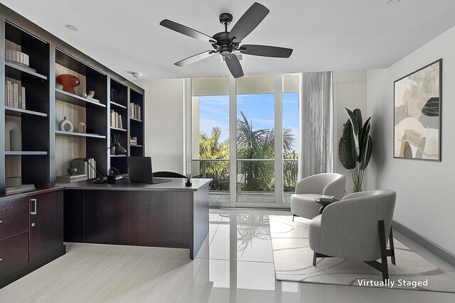 interior space with ceiling fan, expansive windows, and light tile patterned floors