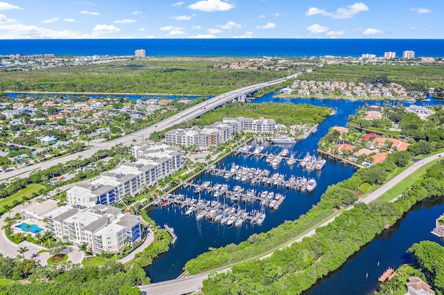 birds eye view of property featuring a water view