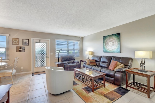 tiled living room featuring a textured ceiling