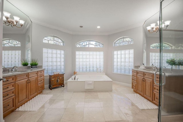 bathroom featuring a chandelier, a healthy amount of sunlight, vanity, and ornamental molding