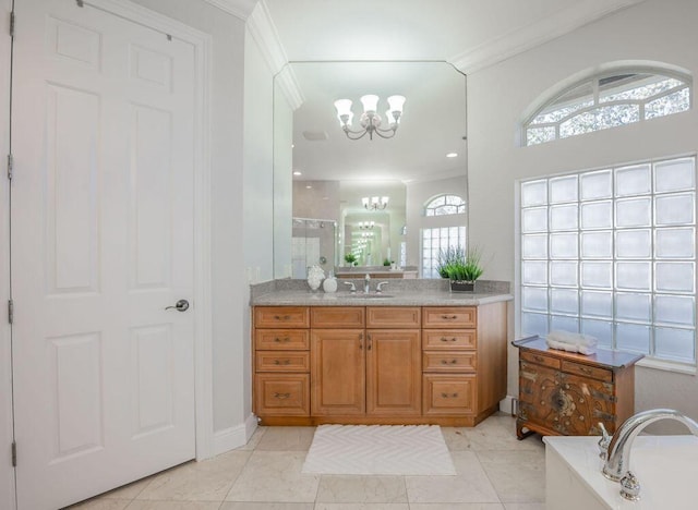 bathroom with a bathing tub, tile patterned floors, crown molding, a chandelier, and vanity