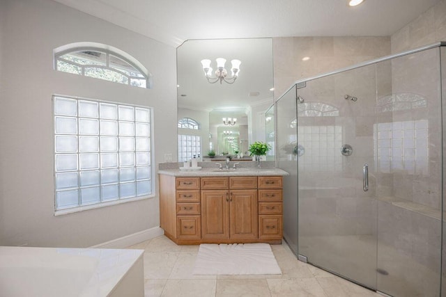 bathroom with vanity, an inviting chandelier, separate shower and tub, and crown molding