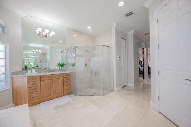 bathroom featuring vanity, ornamental molding, an enclosed shower, and a notable chandelier