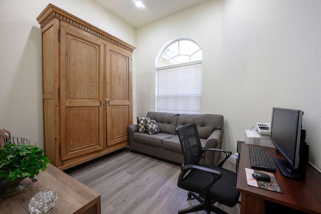 office with hardwood / wood-style flooring