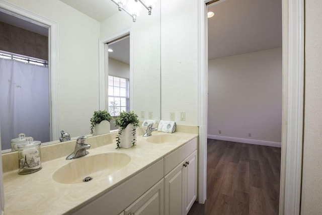 bathroom featuring vanity and wood-type flooring