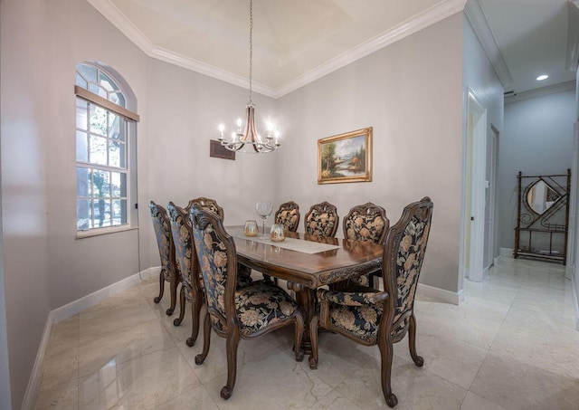 dining space featuring ornamental molding and an inviting chandelier