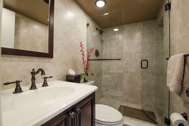 bathroom with vanity, an enclosed shower, and toilet