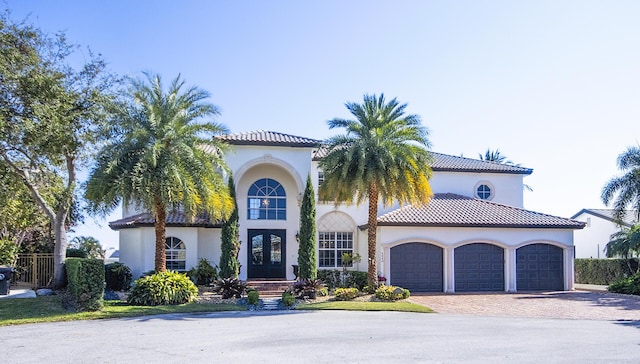 mediterranean / spanish-style house featuring french doors