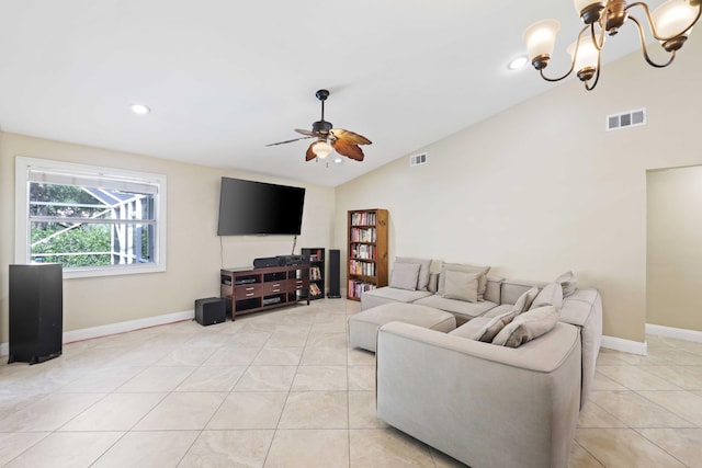 tiled living room featuring ceiling fan with notable chandelier and lofted ceiling