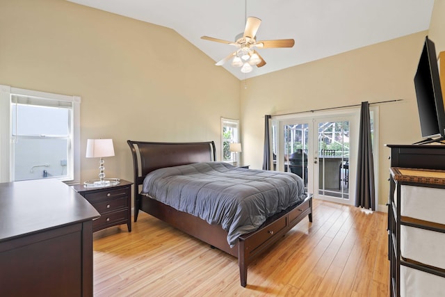 bedroom featuring access to exterior, french doors, vaulted ceiling, ceiling fan, and light hardwood / wood-style flooring