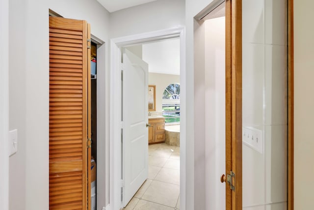 corridor featuring light tile patterned floors