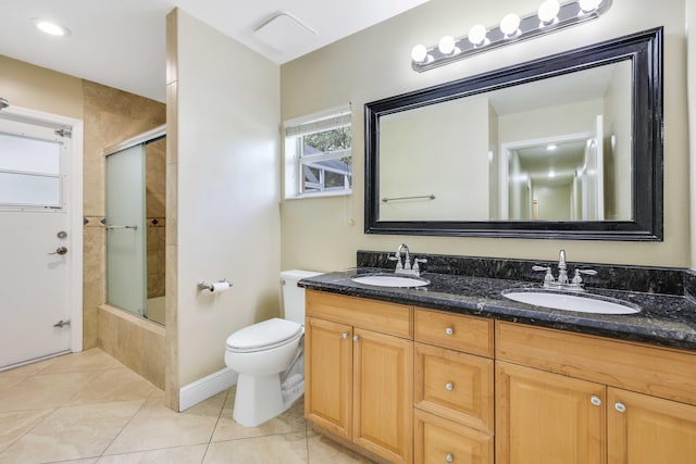 full bathroom with toilet, vanity, tile patterned floors, and combined bath / shower with glass door