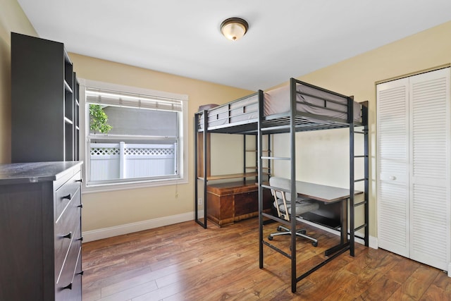 bedroom featuring a closet and wood-type flooring