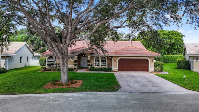 view of front facade with a front lawn and a garage