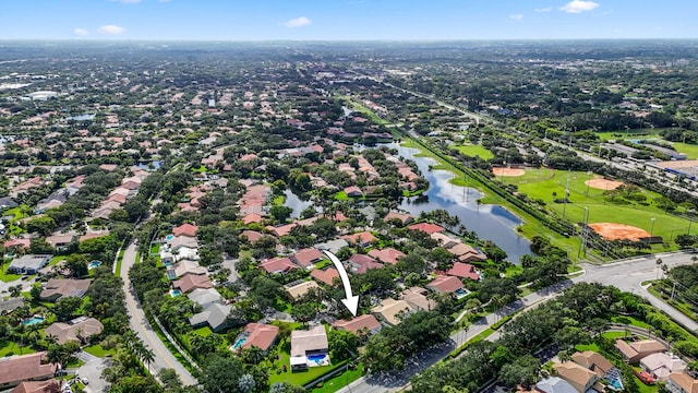 birds eye view of property with a water view