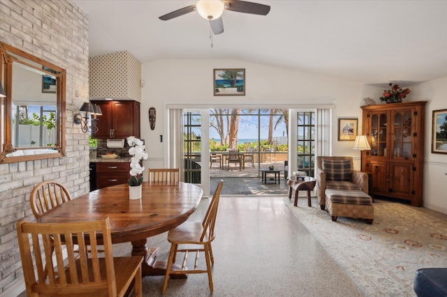 dining space with ceiling fan, lofted ceiling, and plenty of natural light