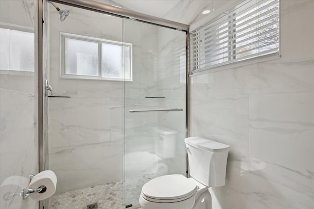 bathroom with toilet, an enclosed shower, and tile walls