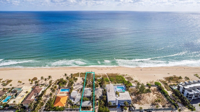 bird's eye view with a view of the beach and a water view