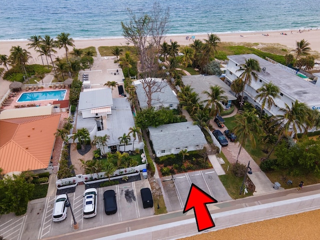 aerial view featuring a water view and a beach view