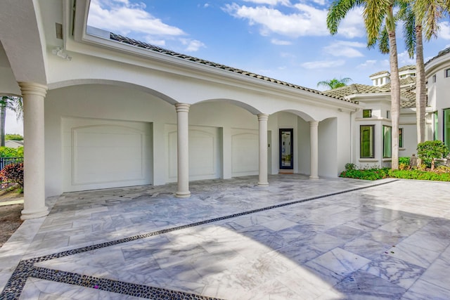 view of patio / terrace with a garage