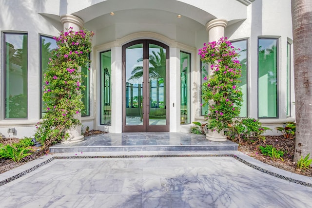 view of exterior entry featuring french doors