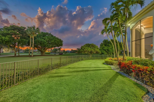 view of yard at dusk