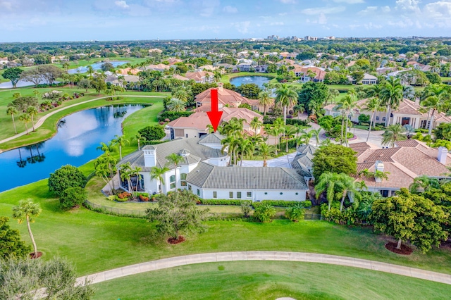 birds eye view of property with a water view