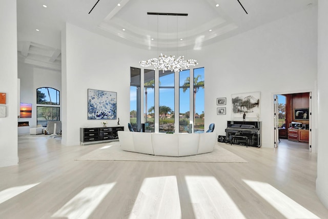 living room featuring plenty of natural light and a high ceiling