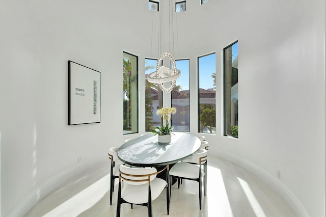 dining area with a high ceiling