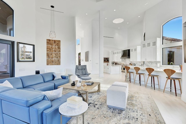 living room featuring a towering ceiling