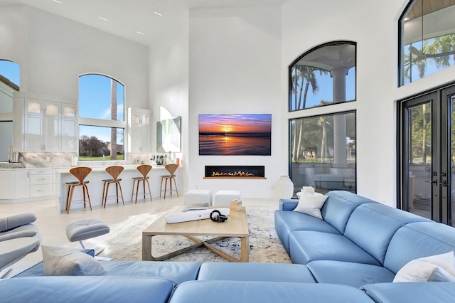 living room featuring a high ceiling