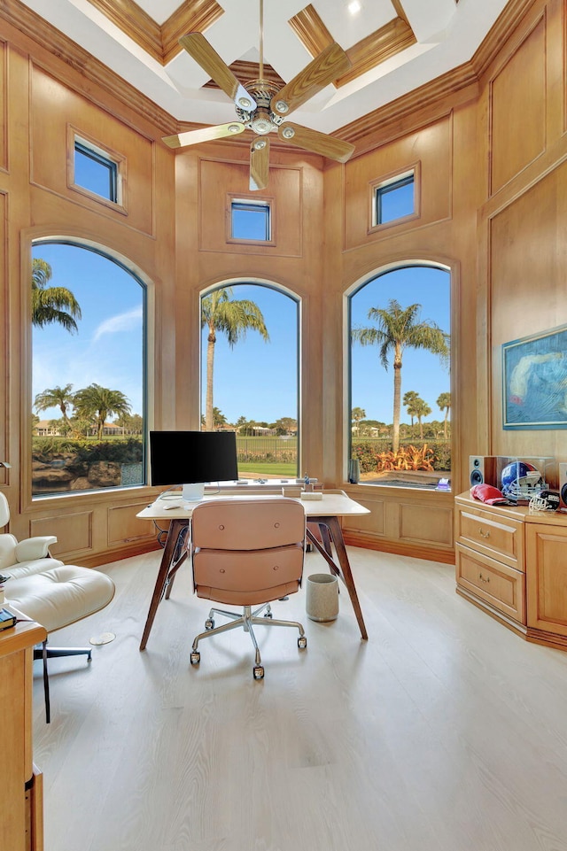 office space featuring beamed ceiling, plenty of natural light, a towering ceiling, and coffered ceiling