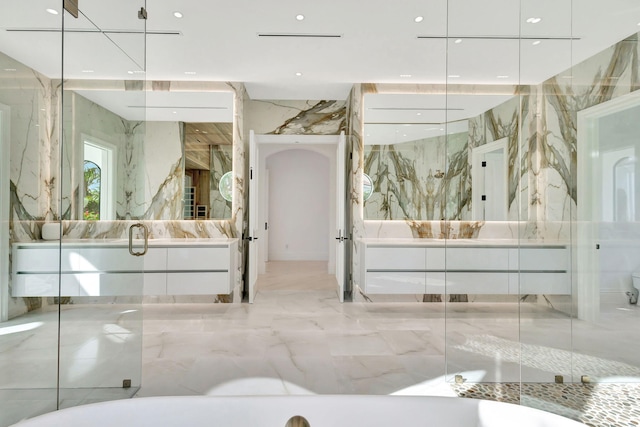 bathroom with vanity and walk in shower