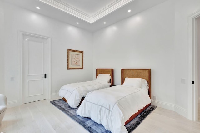 bedroom featuring ornamental molding and a tray ceiling