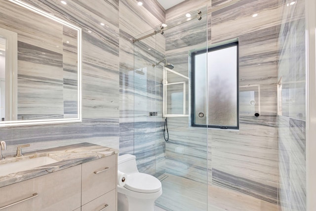 bathroom with vanity, an enclosed shower, and toilet