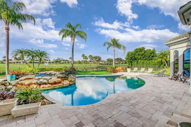 view of swimming pool with a patio