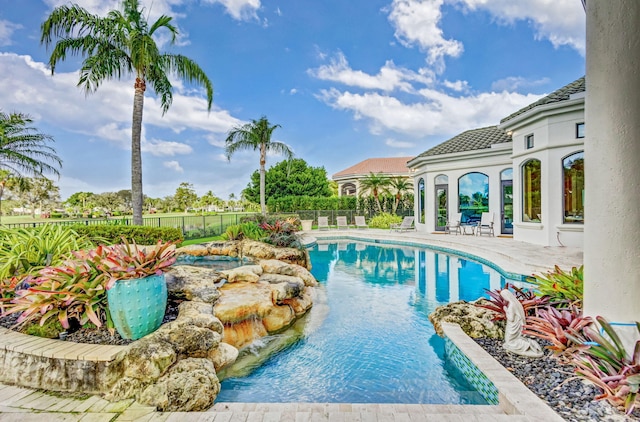 view of swimming pool featuring a patio