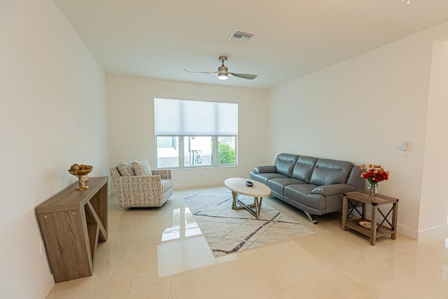 tiled living room featuring ceiling fan