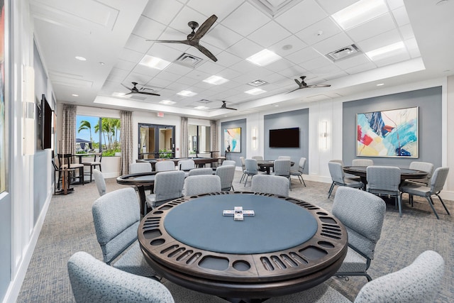 playroom featuring carpet flooring, a tray ceiling, and a paneled ceiling