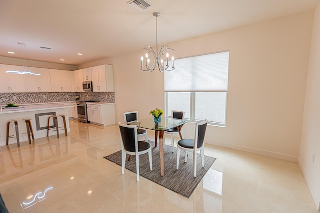 dining area with a notable chandelier