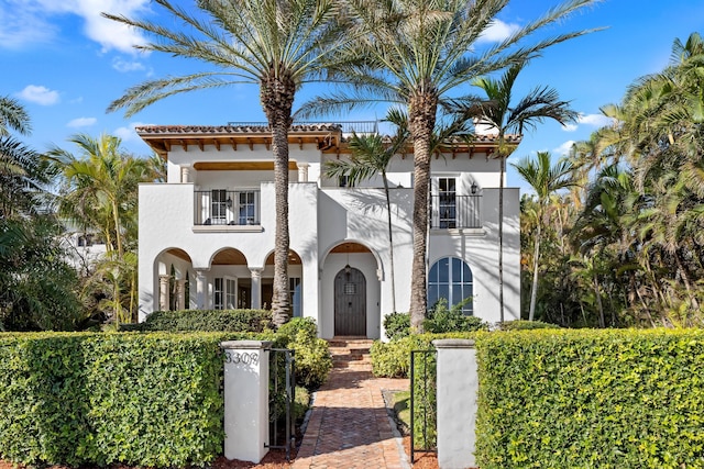 mediterranean / spanish house with a balcony