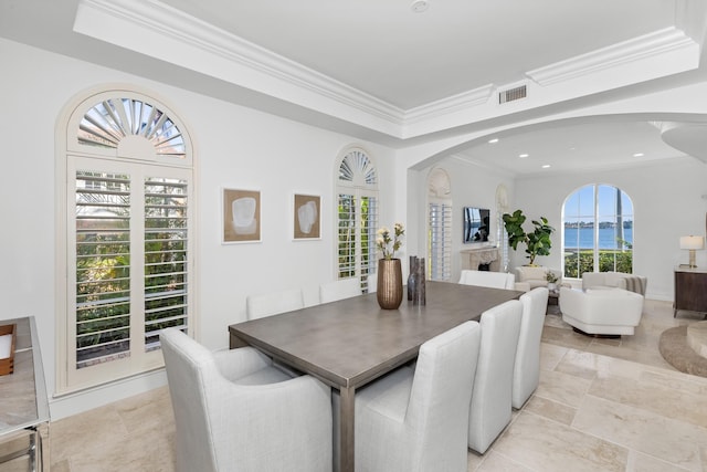 dining space featuring ornamental molding