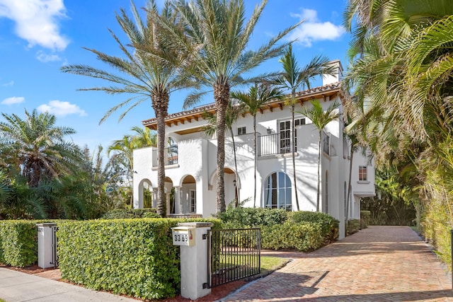 mediterranean / spanish-style home featuring a balcony