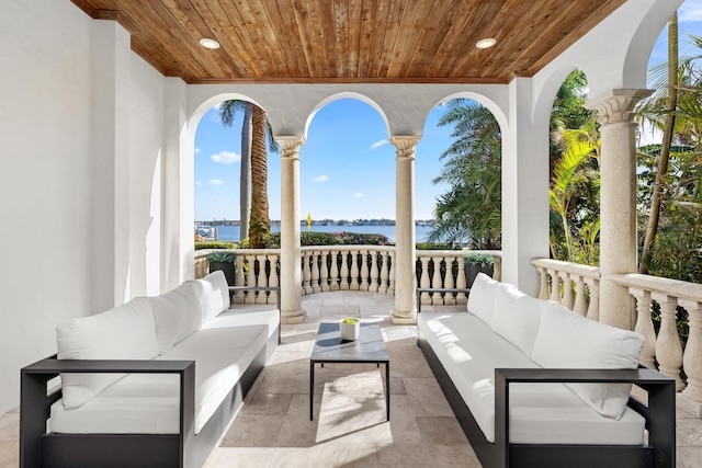 view of patio featuring a water view and an outdoor hangout area