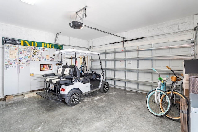 garage featuring a garage door opener