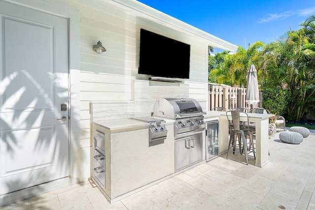 view of patio / terrace with grilling area and exterior kitchen