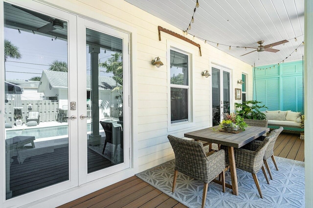 sunroom with french doors, ceiling fan, and wood ceiling