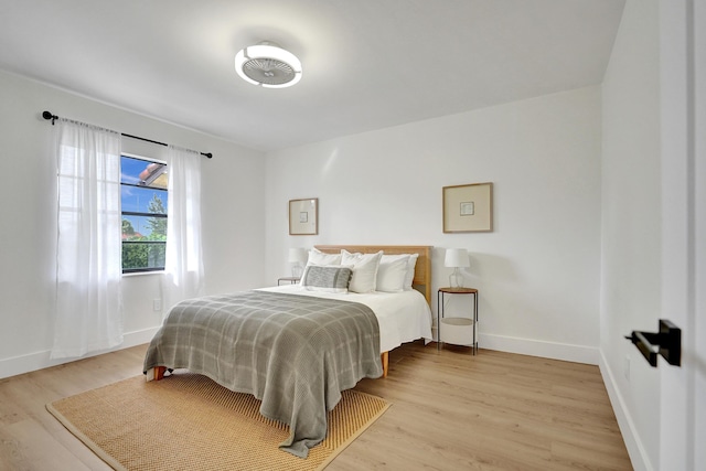 bedroom with light hardwood / wood-style floors