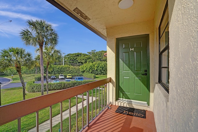 doorway to property featuring a balcony