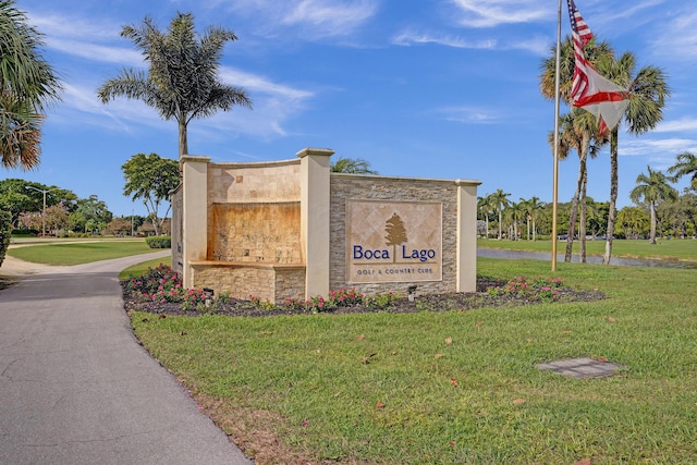 community / neighborhood sign with a lawn